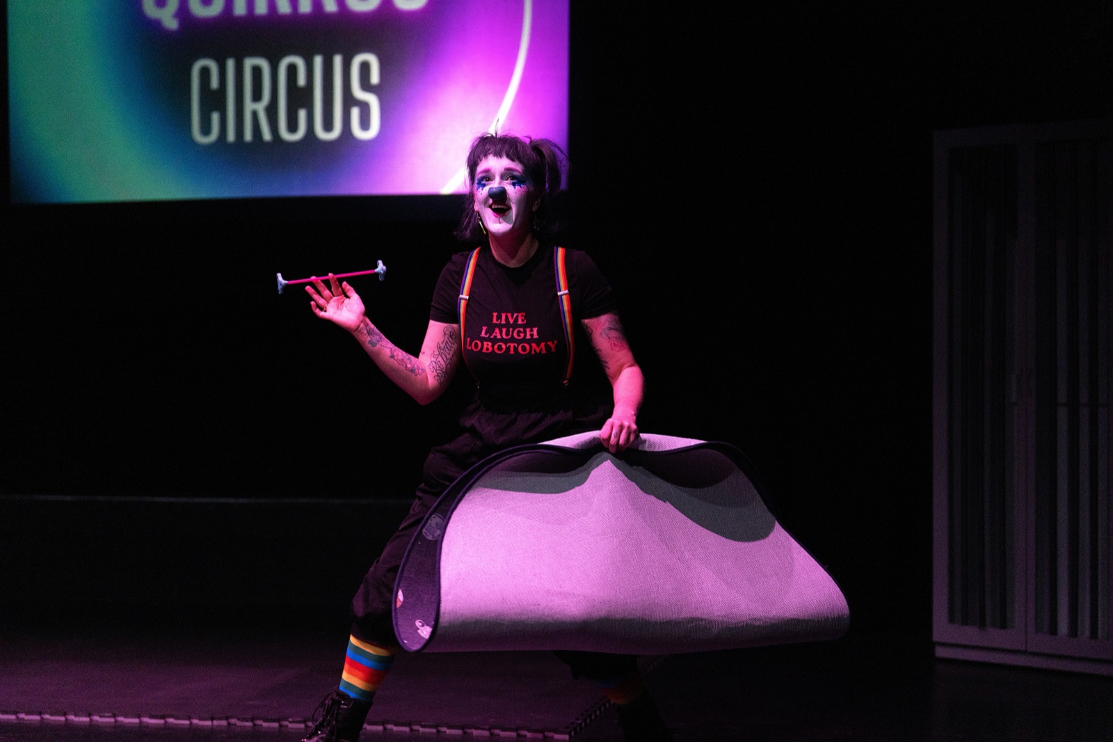 Chow performing in a prop costume on stage